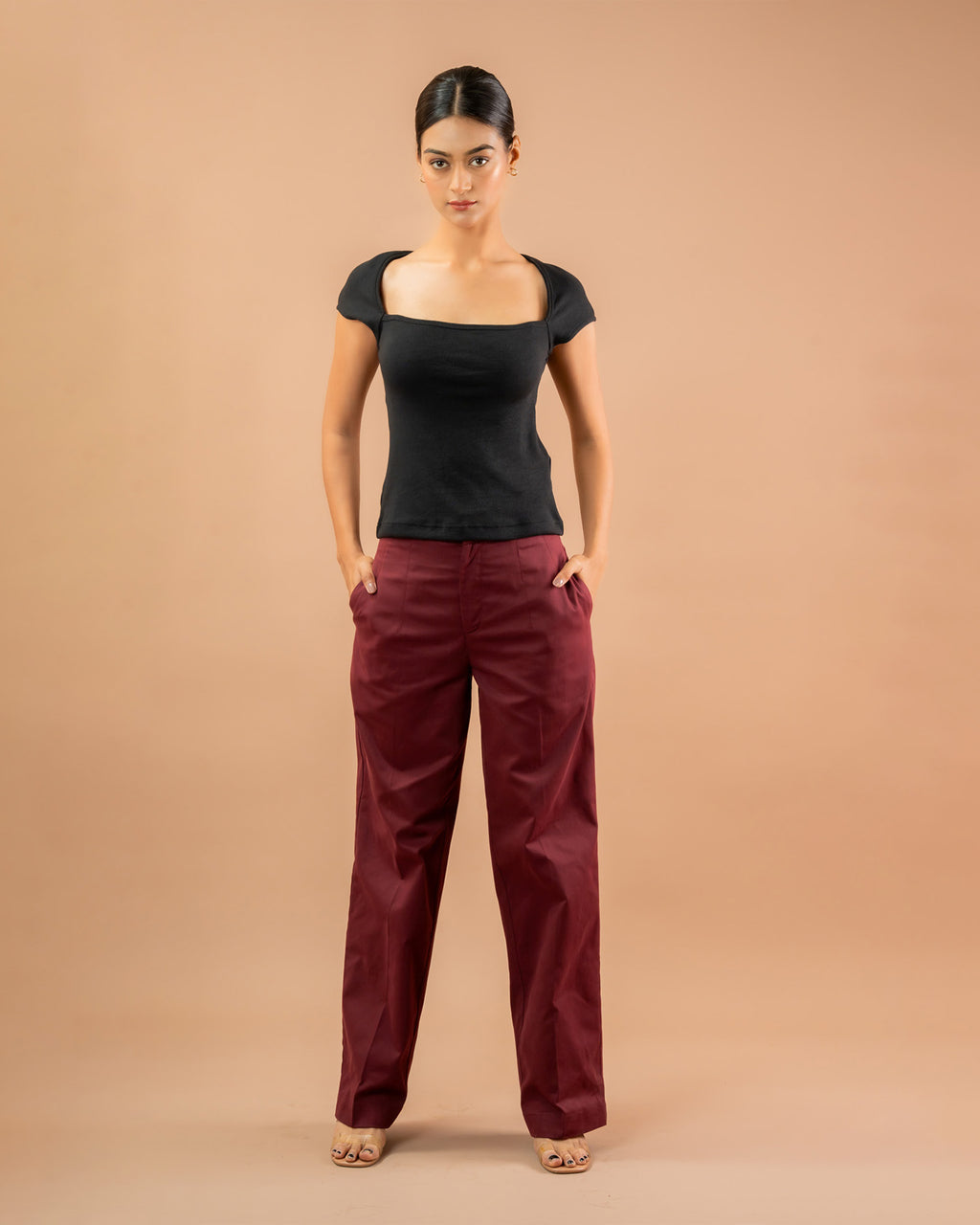 Women’s fitted black top with square neck and cap sleeves, versatile casual styling