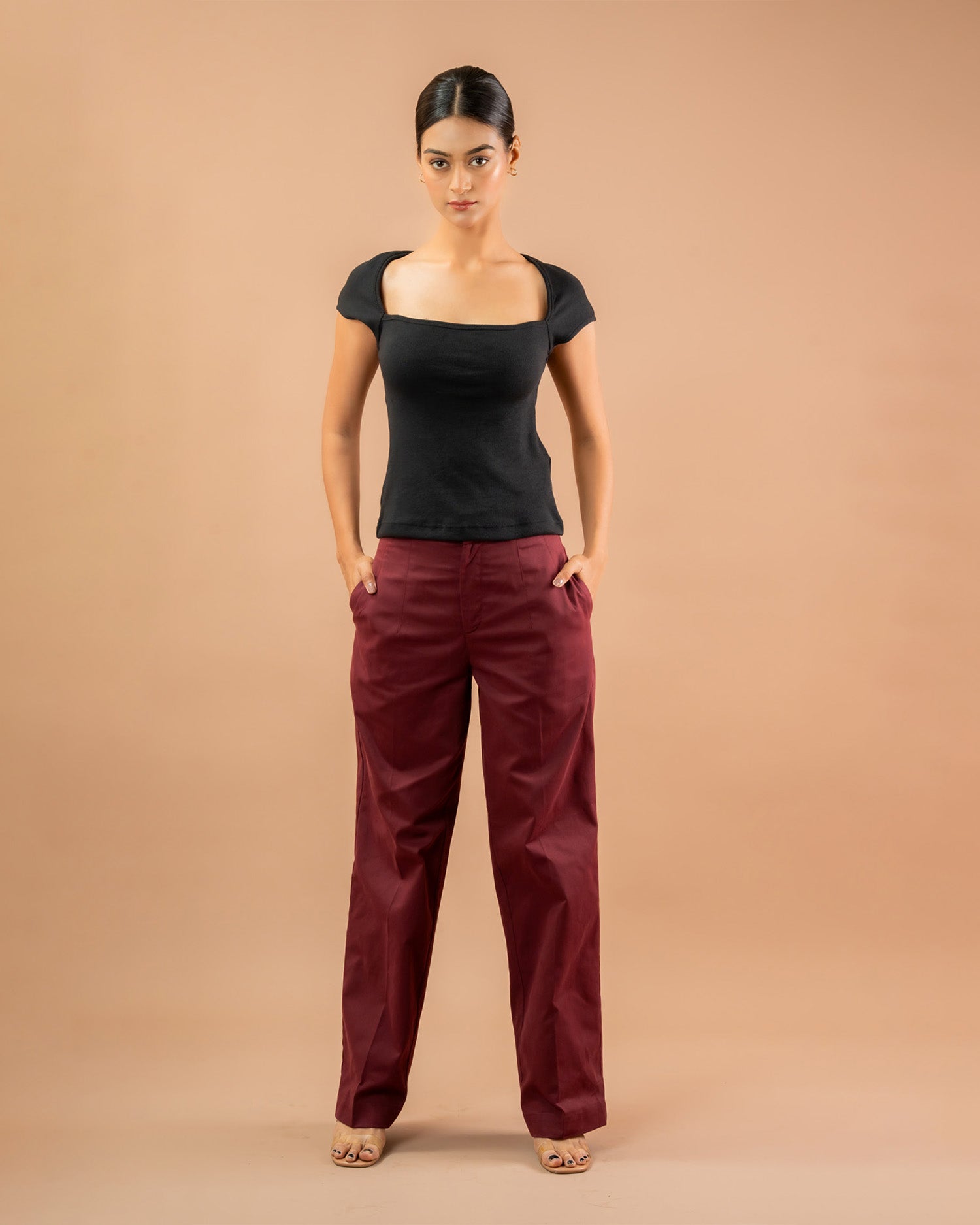 Women’s fitted black top with square neck and cap sleeves, versatile casual styling