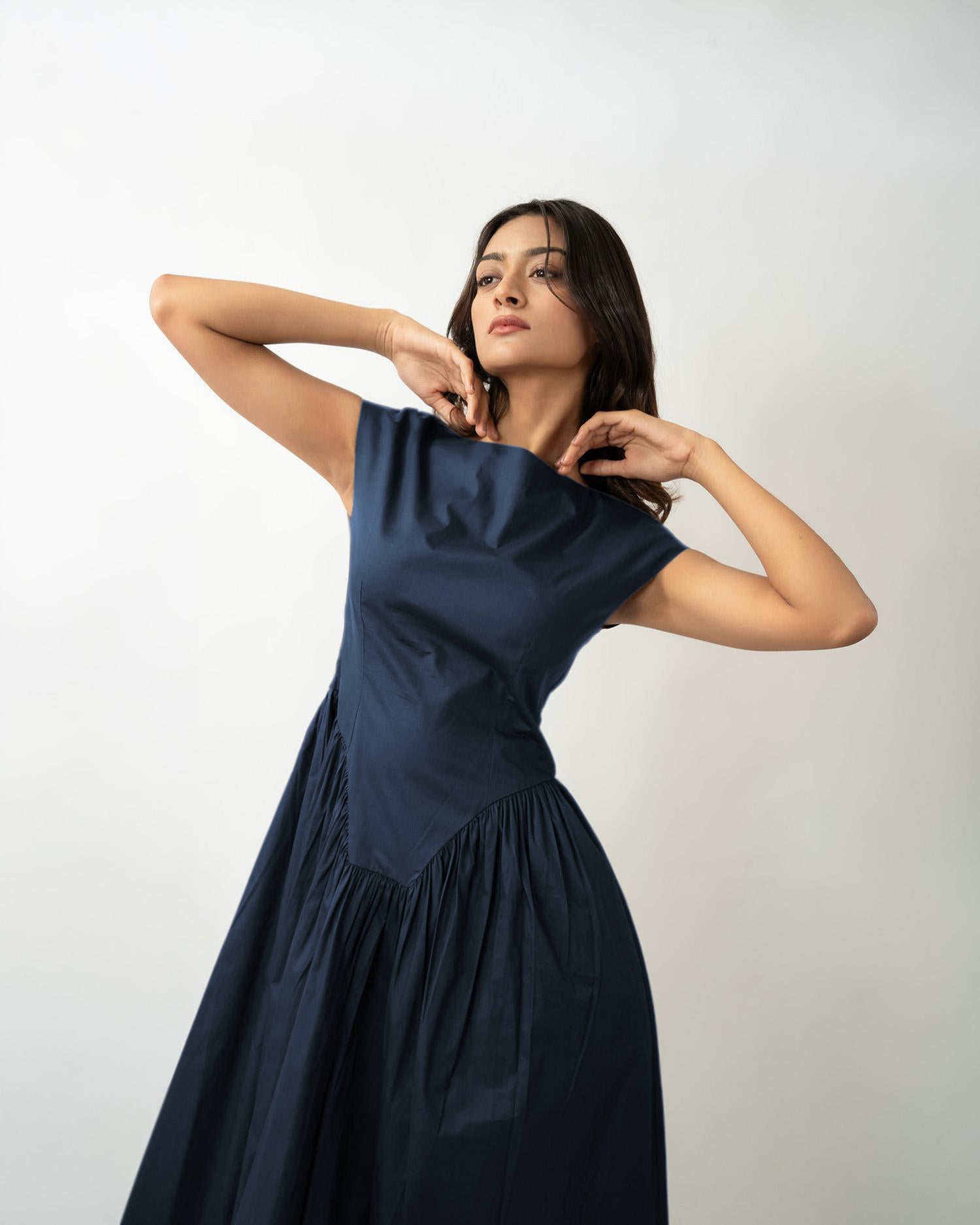 Minimal women’s flared midi dress with boat neckline, soft cotton everyday look