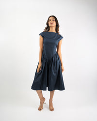 Women’s blue flared midi dress with wide neckline, elegant everyday styling
