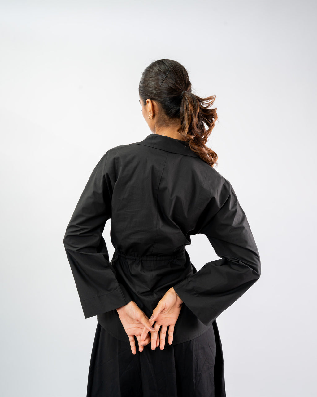 Women’s black button-down top with waist drawstring