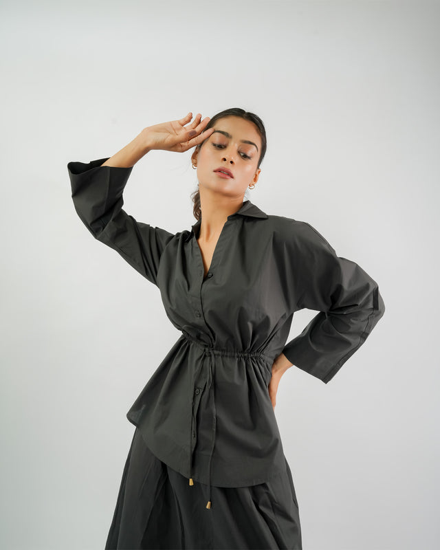 Black collared blouse with gathered waist design